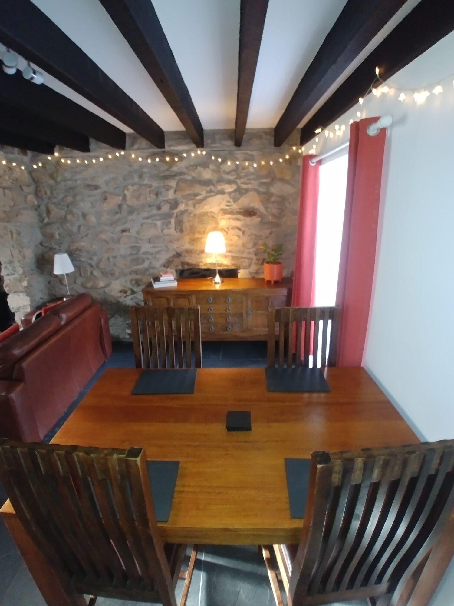 Dining table with stone wall and lamp